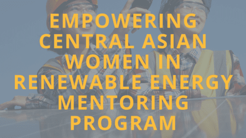 Two women standing by a solar panel, as well as organiser logos