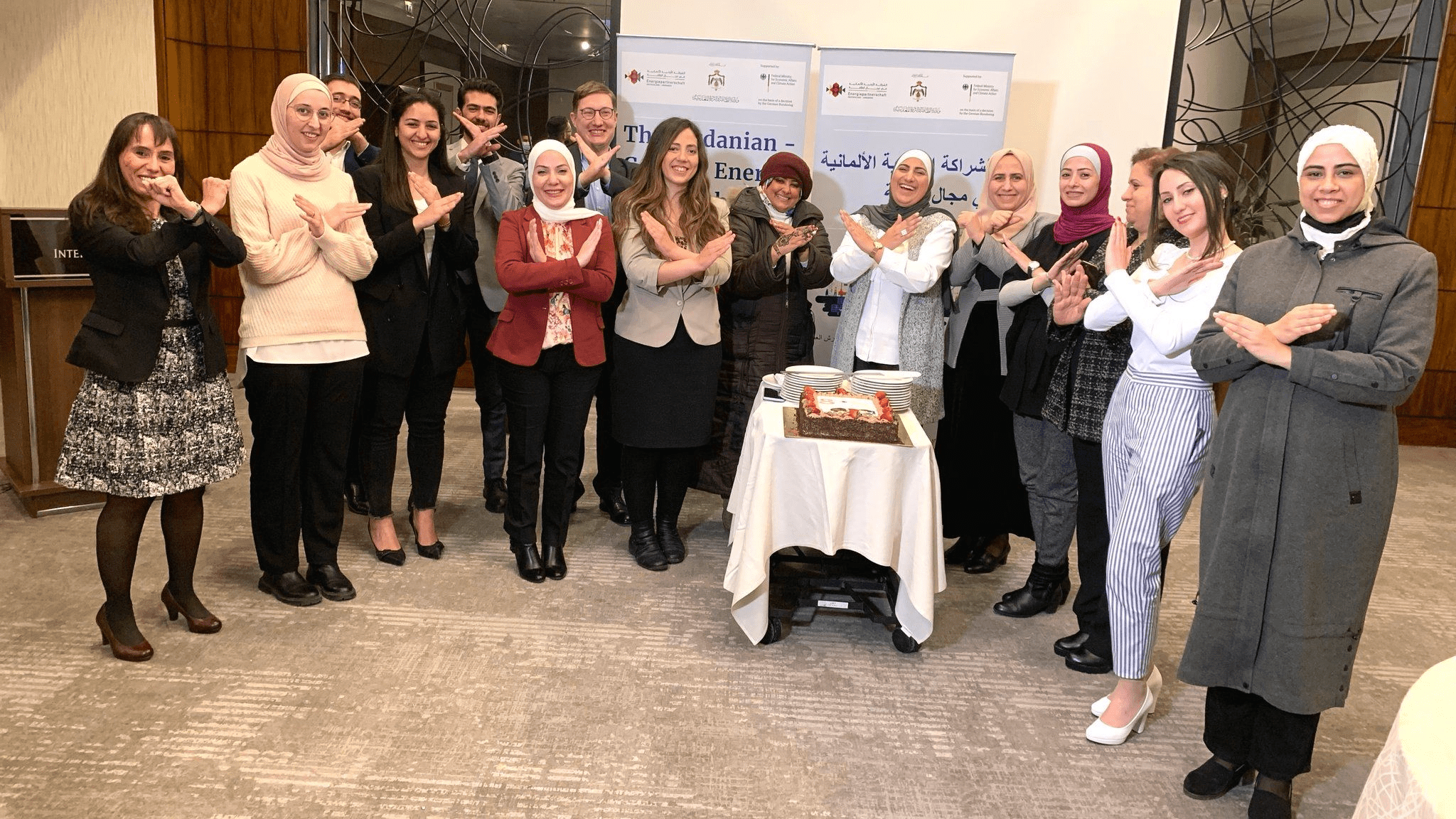 GWNET Jordanian Mentees Networking Event Group photo of Jordanian women showing the breaking the bias hand sign