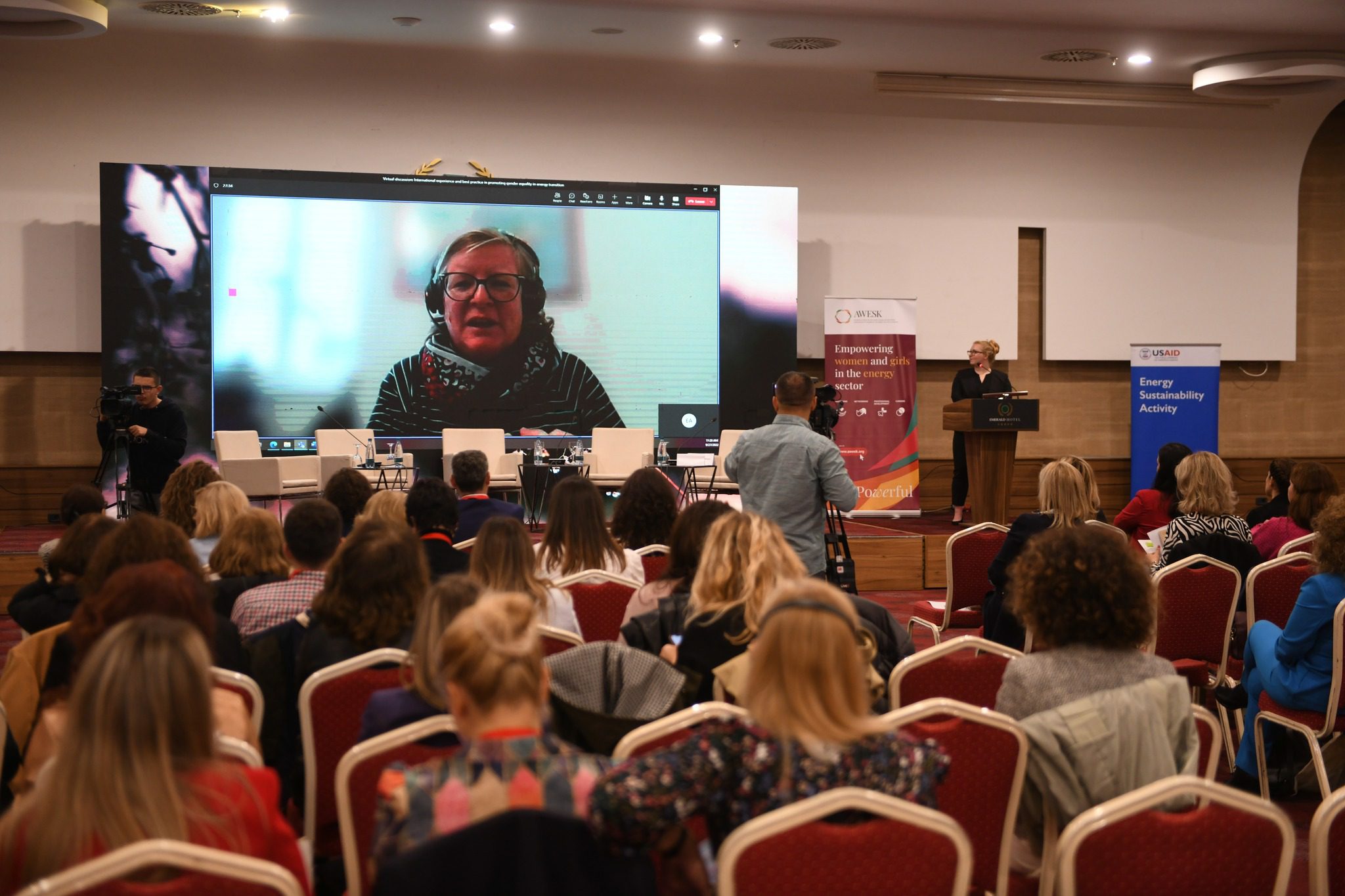 Christine Lins AWESK Audience looks on as Christine Lins delivers virtual message during conference