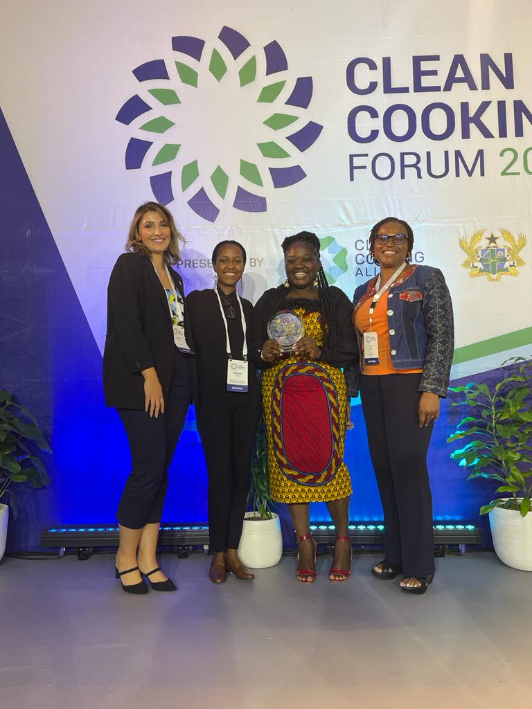 Four women standing in front of the clean cooking forum banner