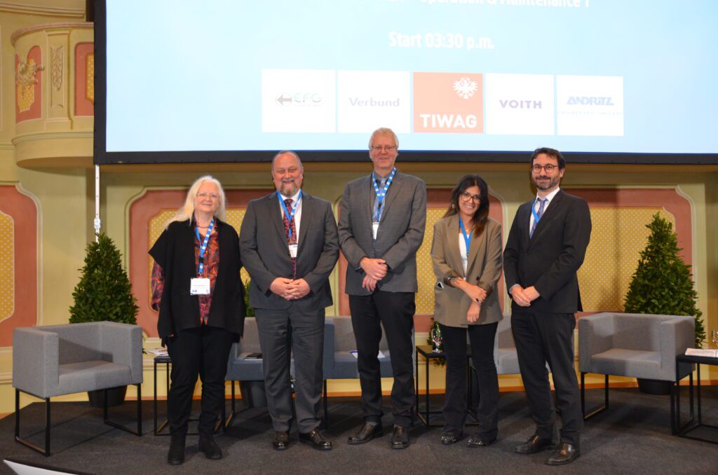 Speakers standing on stage